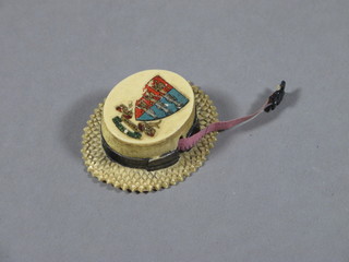 A carved ivory miniature tape measure in the form of a boater,  the top decorated the Arms of Great Yarmouth 2"