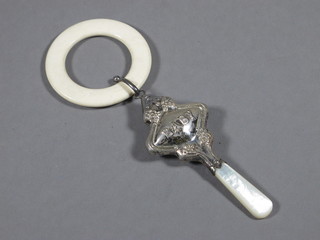 A modern silver baby's rattle with mother of pearl teething bar
