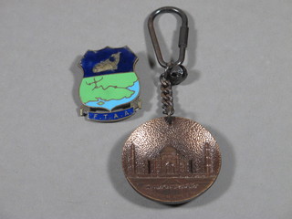 An enamelled Angling Association badge FTAA and a key ring decorated the Taj Mahal