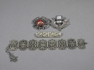 An Eastern pierced white metal bracelet, a silver and polished  hardstone brooch and 2 other brooches