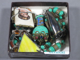 A green hardstone necklet, a silver and hardstone brooch, an enamelled brooch, a white metal button hole vase and a triangular  pendant hung a fine chain