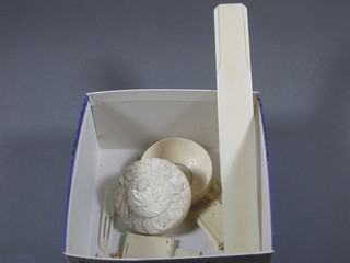 A turned ivory jar and cover 3", an ivory paper knife and an  ivory model of a cart, f,