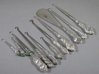 10 various silver handled button hooks and a silver handled shoe horn