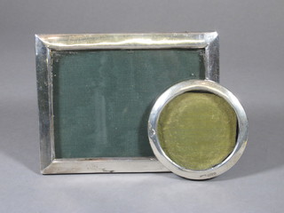 An Edwardian circular silver easel photograph frame 3 1/2" and  a rectangular do. Birmingham 1938 5" x 6 1/2"