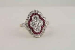 An 18ct yellow gold dress ring set rubies and diamonds, approx 1ct