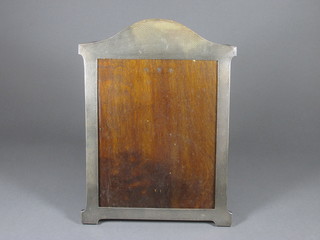 An arched silver easel photograph frame 10" x 8", marks rubbed