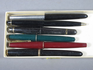 A black Parker Duofold fountain pen, a red Parker 17 fountain  pen, a green Parker 17 Lady fountain pen, a black fountain pen,  a Ceek fountain pen and a biro