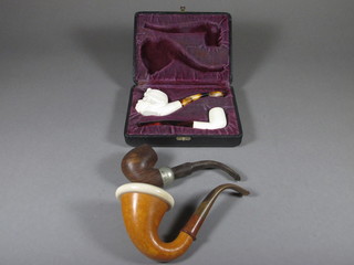 A Meerschaum pipe, the bowl in the form of a Turks head, a  Calabash pipe and 2 others