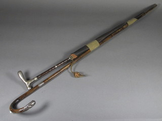A bamboo walking stick with silver mounts and a do. umbrella
