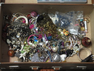 A case of various costume jewellery