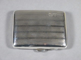 An engraved silver cigarette case with engine turned decoration Birmingham 1933, 2 ozs
