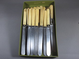 12 table knives by J W Benson and 10 tea knives, a steel and a carving fork