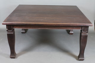 A square mahogany dining table, raised on square tapering  supports 59"