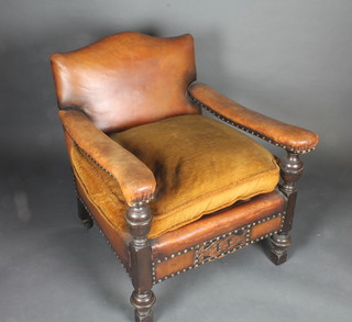 A 1930's oak and leather 2 seat settee and matching armchair