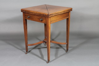 An Edwardian walnut envelope card table fitted a drawer and raised on square tapering supports with X framed stretcher 21"