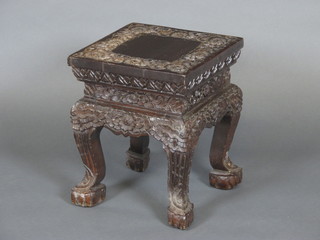 An Oriental square carved jardiniere stand raised on cabriole supports 12"