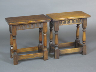 A pair of rectangular oak stools with arcaded decoration, raised  on turned and block supports 18"