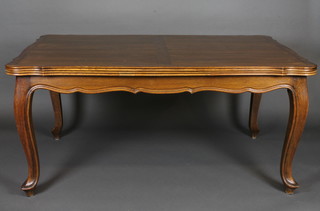 A French oak refectory dining table, raised on cabriole supports  63"