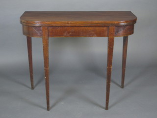 A Georgian mahogany D shaped tea table, raised on square  tapering supports 38"