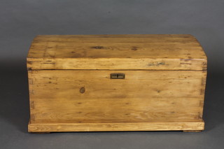 A Continental stripped and polished pine dome trunk with iron  drop handles 39"