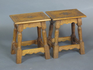 A pair of rectangular carved honey oak stools, raised on turned  and block supports 13"