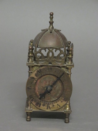 A brass lantern clock by Smiths