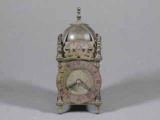 A Smiths electric lantern clock contained in a brass case 3"