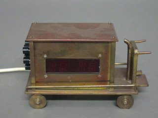 A brass digital clock in the form of an electric trolley 7"