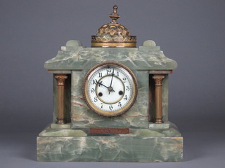 A Victorian French 8 day striking mantel clock with enamelled  dial and Arabic numerals contained in an onyx architectural case   ILLUSTRATED