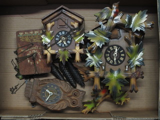 2 20th Century German Swiss cuckoo clocks, a 1920's English  clock in the form of an owl and 1 other wall clock