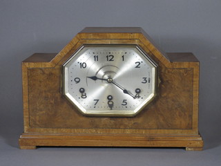 A 1930's chiming mantel clock with diamond shaped silvered  dial and Arabic numerals contained in a walnut case