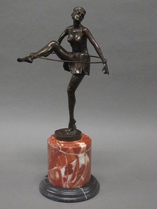 An Art Deco style bronze figure of a dancing girl with hoop,  raised on a turned marble base 20"