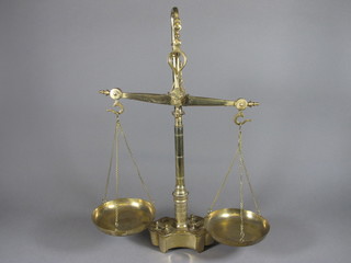 A pair of brass scales complete with weights