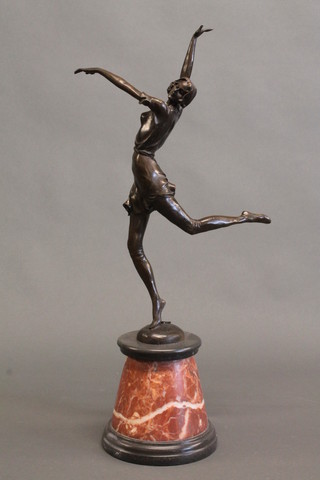 An Art Deco style bronze figure of a dancing lady, raised on a conical 2 colour marble base 23"