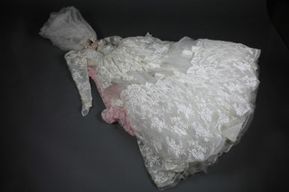 A 1930's wedding dress together with a pink strapless dress