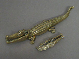 A pair of brass nut crackers in the form of a crocodile and an Eastern pair of nut crackers 5"
