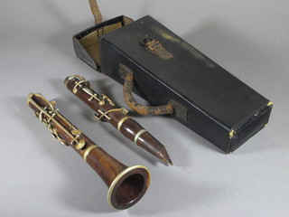A 2 piece rosewood clarinet complete with carrying case