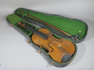 A violin with 2 piece back labelled Antonius Stradivarius  Cremona Faciebat Anno 1690