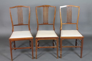 A set of 3 Edwardian inlaid mahogany stick and rail back  bedroom chairs with upholstered seats