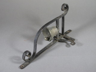 A metal bell with cradle