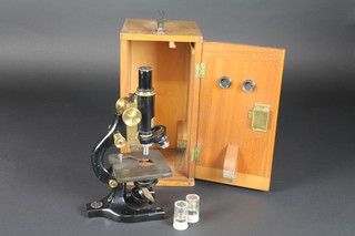 A monocular microscope by H F Angus & Co London together  with 2 extra lenses and carrying case
