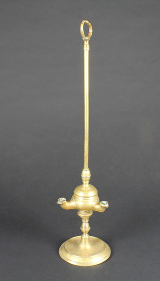 A brass 3 light oil lamp