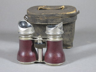 A 19th/20th Century chrome framed binoculars complete with  leather carrying case