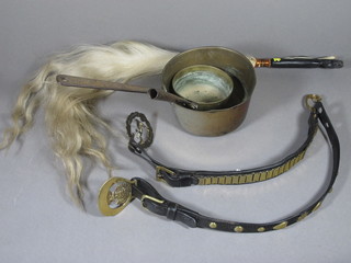 An 18th/19th Century circular brass saucepan with iron handle 5"  and 1 other 7", a fly swish and 2 items of horse harness