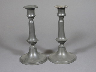A pair of 18th Century pewter candlesticks with ejectors 9"