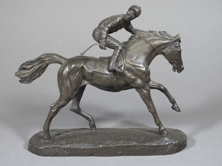 A bronzed figure of a race horse with jockey up 9"