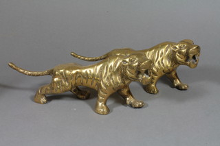 A pair of brass figures of walking tigers 11"