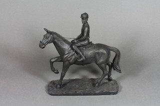 A bronzed figure of a race horse with jockey up 10"