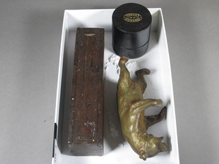 A gilt painted figure of a standing bear 4 1/2", a set of miniature  bone dominoes in a wooden case and a Garrould medicine  measure