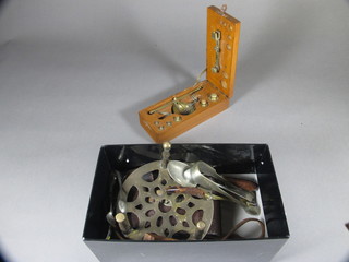 A folding Voigtlander camera, a set of scales, a circular brass  trivet and a small collection of flatware